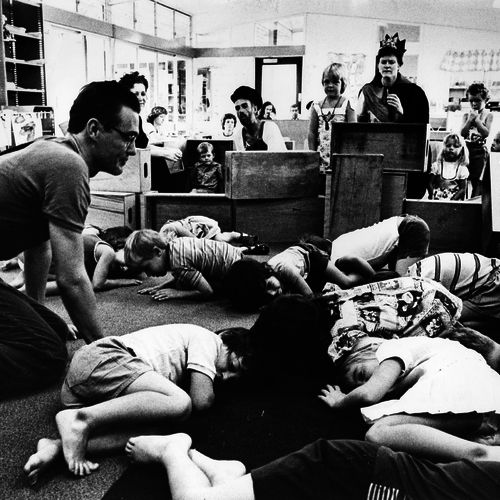 A 1970s ECDP team in action at Zillmere Pre-School, Brisbane. Chris Burns in foreground, Sally McKenzie partly obscured, Doug Anders with hat and Linda Sproul with crown.